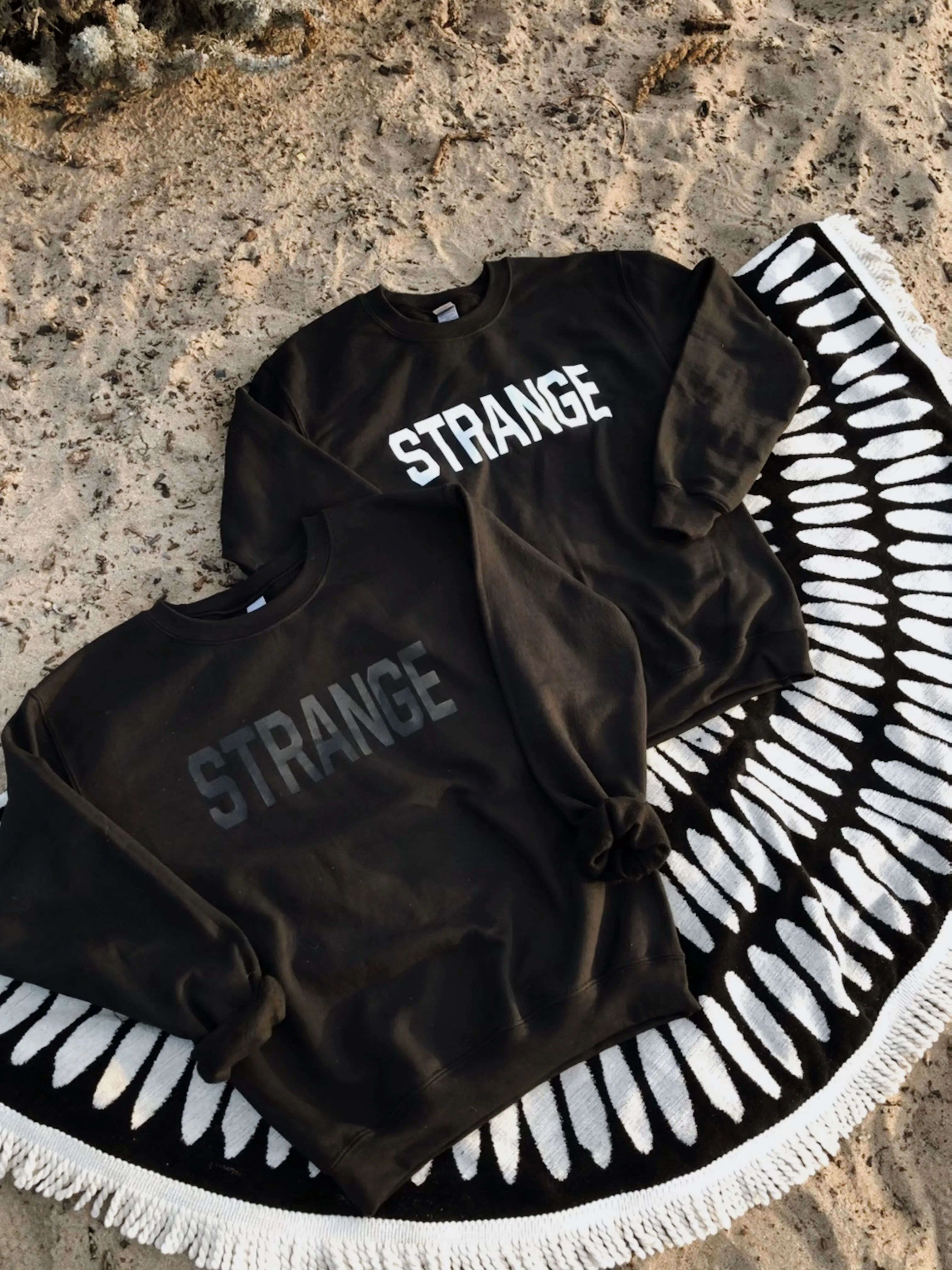 "STRANGE" OG Crewneck Sweatshirts