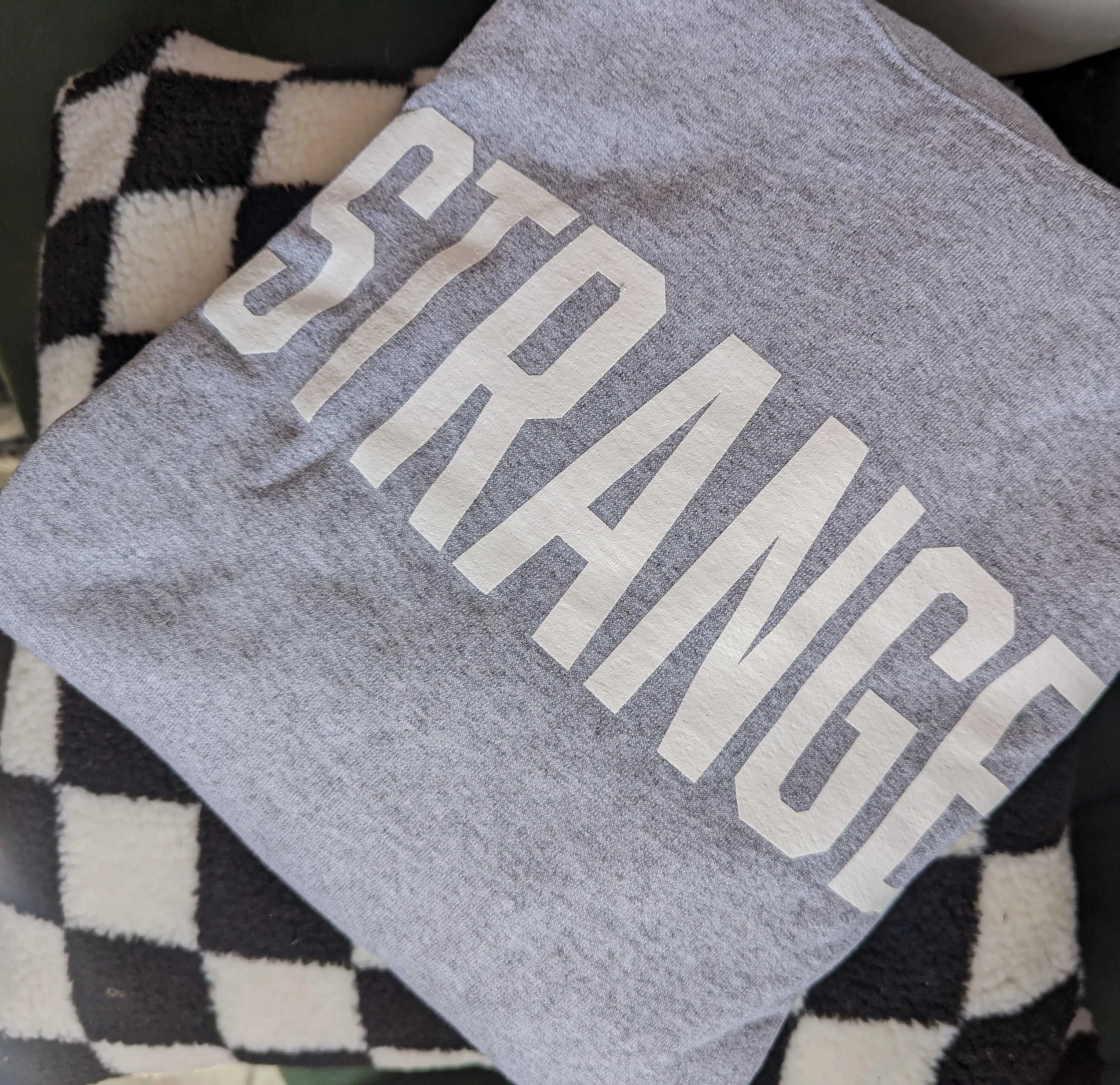 "STRANGE" OG Crewneck Sweatshirts