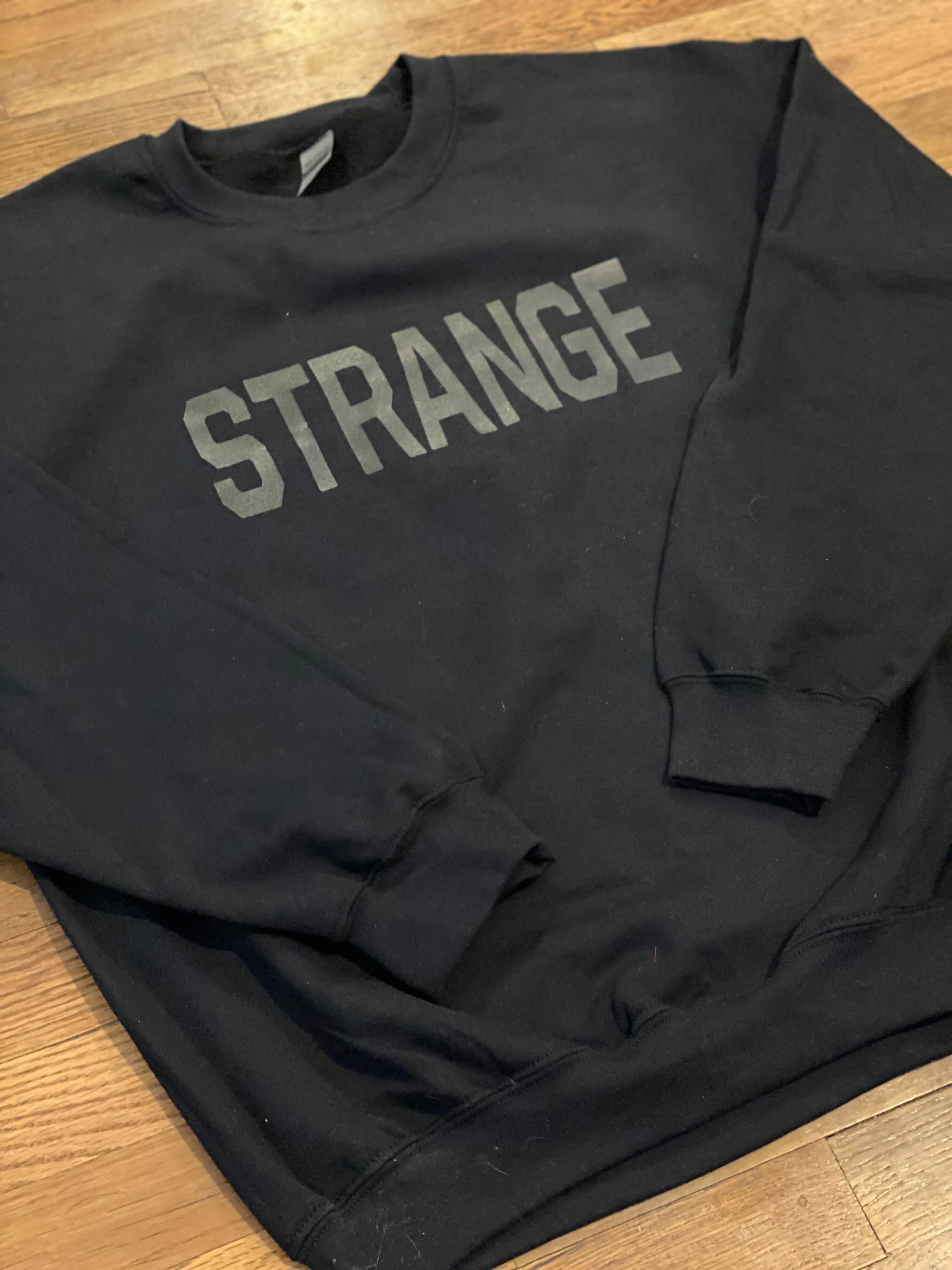"STRANGE" OG Crewneck Sweatshirts
